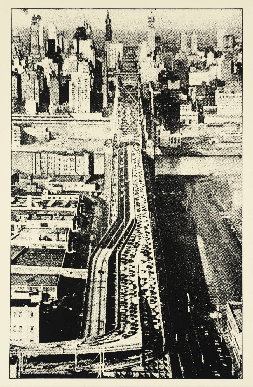 A black and white picture showing a city from above.