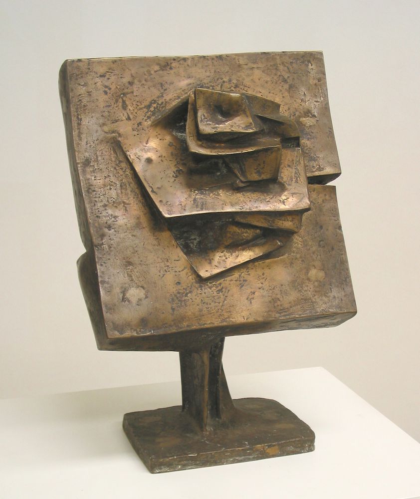 A plate with protruding, flower-like edges. The plate has a foot on which it stands.