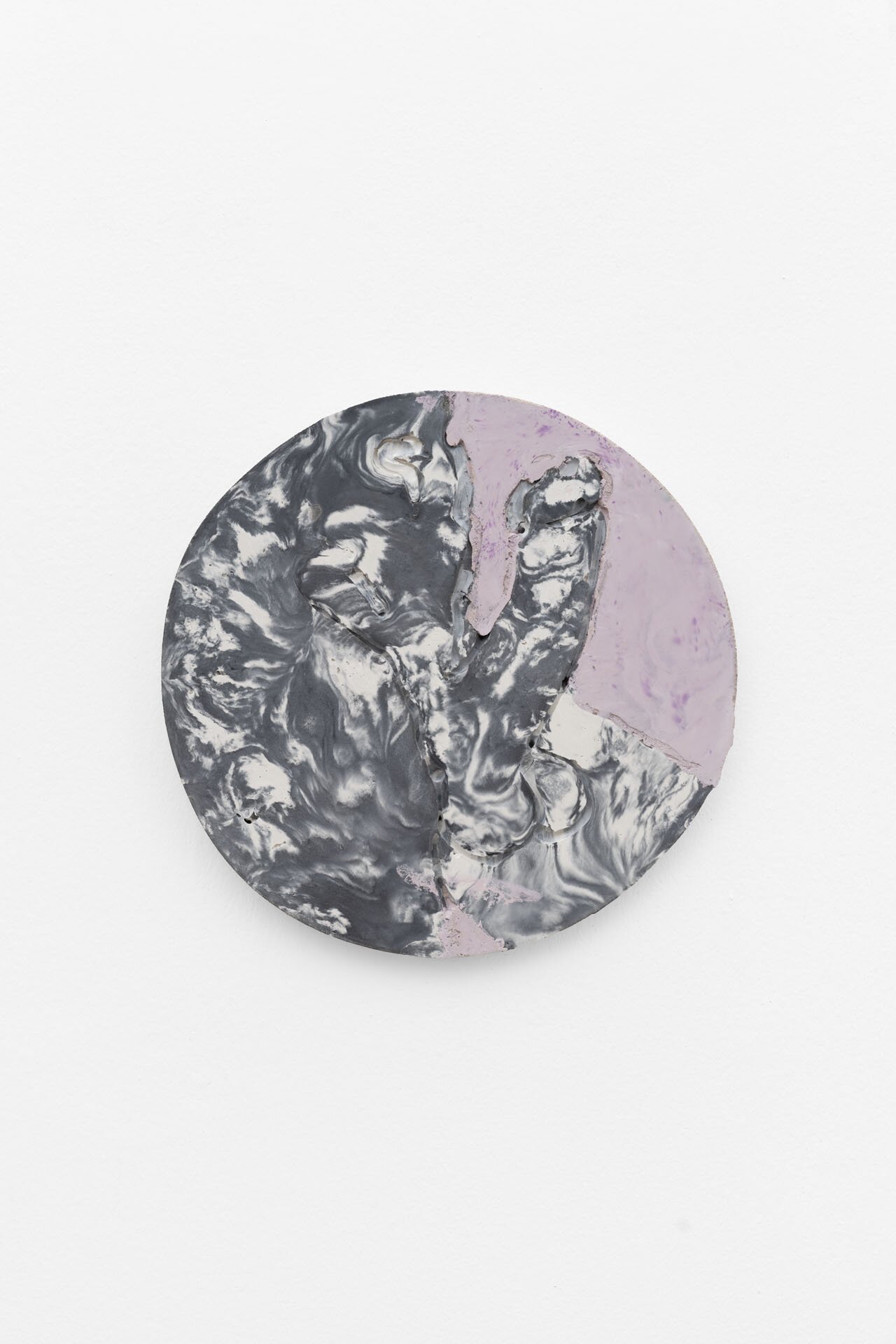 Round disk in marble look with the image of an erect phallus